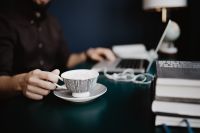 Kaboompics - Male working with a laptop and a cup of coffee