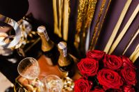 New Year's Eve party - bottle of champagne, glasses & red roses