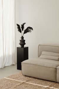 Kaboompics - Jute rug - books - vase - fragrance diffuser - magazine - black - dried pampas grass