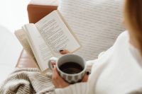Kaboompics - A woman reads a book - a cup of tea