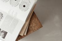 Kaboompics - Opened book - wooden side table