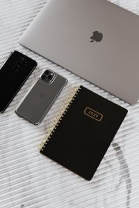 Kaboompics - Mobile Phones, planner & laptop on marble