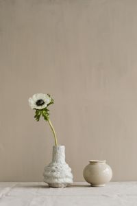 Flowers in small ceramic vases - beige neutral aesthetics