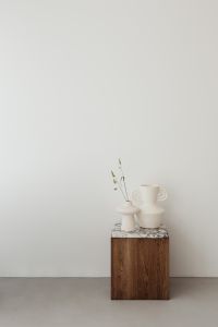 Kaboompics - Wooden side table with marble top - bright ceramic vases