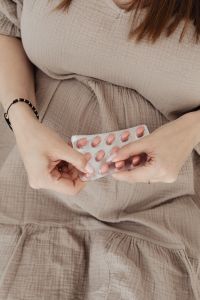 Pregnant Woman Taking Vitamin Pills