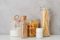 Kaboompics - Farfalle, spaghetti pasta in jars, wheat flour and chickpeas