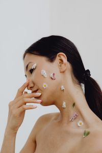 Sensual Portrait Of A Asian Woman With Flowers On Her Face