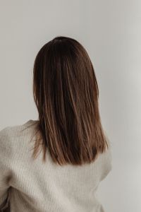 Kaboompics - The back of a young woman - medium-length brown straight hair