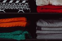 Colourful clothes in a wardrobe