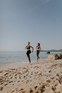 Women jogging on the beach