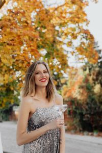 Kaboompics - Blond Woman in a Sequin Dress is Holding a Glass of Champagne, Autumn