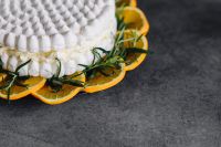 Kaboompics - Meringue Cake with whipped cream and oranges