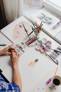 Kaboompics - A woman paints with watercolors