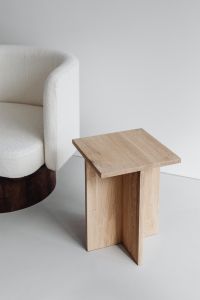 Kaboompics - Modern oak side table - armchair with light boucle fabric - minimalist interior