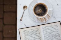 Kaboompics - Cup of Coffee and an Open Book