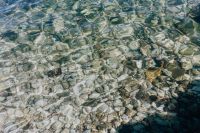 Kaboompics - A close-up of stones in turquoise water, Isola, Slovenia