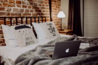 Kaboompics - Enjoying evening with a Macbook in a nice bed