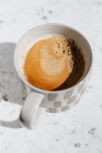 Kaboompics - A cup of coffee on white marble
