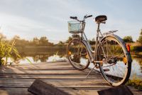 Kaboompics - Bicycle with basket on the pier in bright sunset light