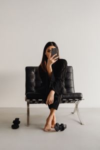 Kaboompics - Dark Classy Aesthetic Fashion - Beautiful Asian Female Entrepreneur in Black Suit - Technology and Devices - iPhone - Laptop - AirPods
