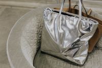 Kaboompics - Women's handbags on the Chance tub chair, Saba Italia