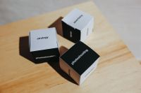 Kaboompics - Little paper boxes with words on them