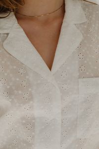 Woman in white cotton pajamas