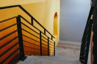 Kaboompics - Staircase by a yellow wall