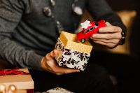 Kaboompics - A handsome man with Christmas presents - toy car
