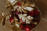 Red apples and golden oak leaves