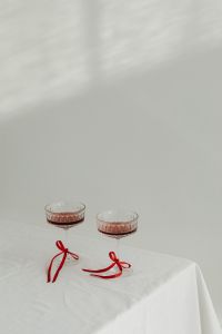 Kaboompics - Elegant Toast - Vintage Wine Glasses with Red Ribbon Accents