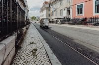 Kaboompics - Tuk tuk car with tourists driving in Lisbon street, Portugal