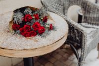 Kaboompics - Winter bouquet with red carnations and pine