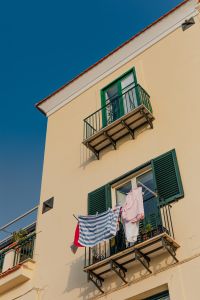Kaboompics - Typical Italian balcony in an old house with drying laundry
