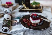 Kaboompics - Cheesecake and magazine on a marble table