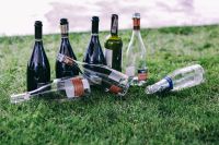 Kaboompics - Empty wine bottles on the grass