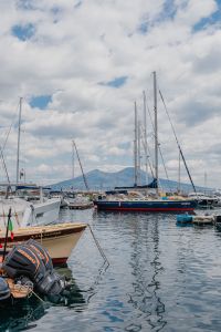 Kaboompics - Boats moored in a marina in Naples, Vesuvius volcano in the background