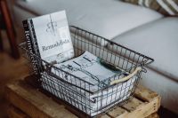 Kaboompics - Magazines in a metal basket