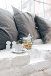 Morning coffee with a jar of brown sugar with pillows