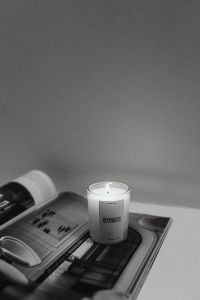 Luxurious Scented Candle on Marble Surface with Lifestyle Magazine - UGC Style Home Decor Photography