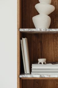 Kaboompics - Books on a bookcase - marble shelves