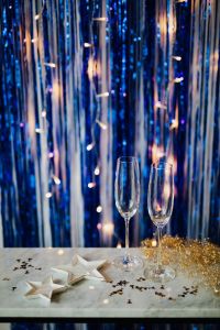 Kaboompics - New Year's Eve - champagne glasses on a blue background