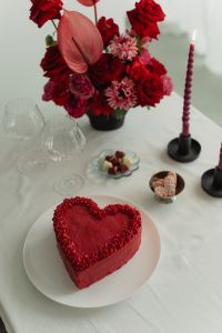 Wine Glasses with Red Ribbon Accents - Heart-Shaped Cake - Red Flowers