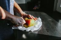 Kaboompics - Woman cutting an apple