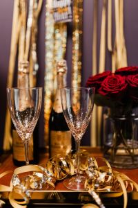 New Year's Eve party - bottle of champagne, glasses & red roses