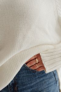 Kaboompics - Woman in white sweater - gold rings - jewelry - jeans
