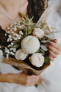 Kaboompics - A woman in underwear is holding a beautiful pastel bouquet