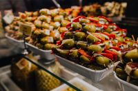Kaboompics - An assortment of olive snacks displayed for sale at San Miguel market.