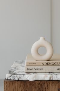 Kaboompics - Ceramic vase - side table - walnut wood - marble - books
