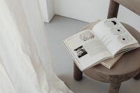 Kaboompics - Grey beige upholstered dining chair - open books - greige
